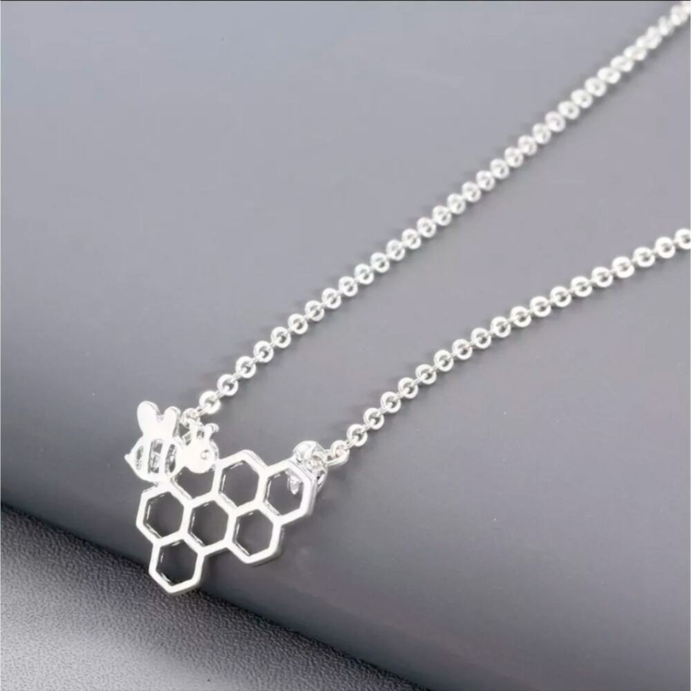 Silver tone bee and honeycomb bumblebee necklace